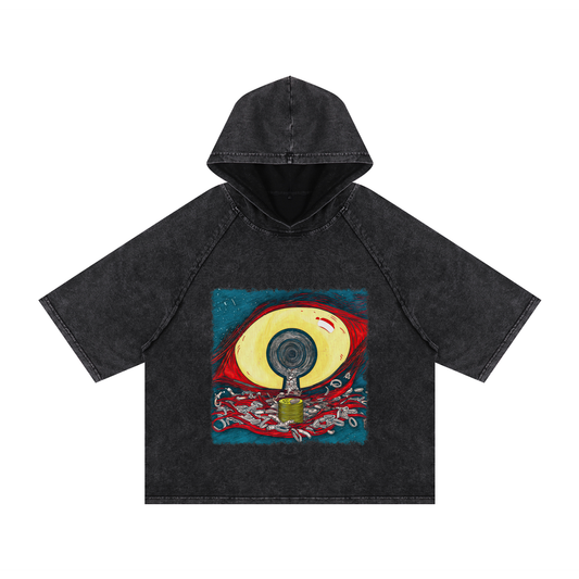 Golden eye with crimson strands and scattered coins, printed on a snow-washed cotton hooded t-shirt, symbolizing wealth and reflection.